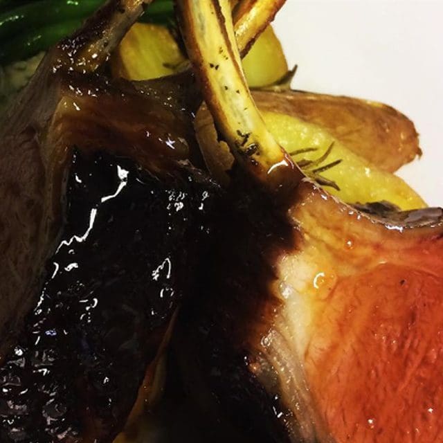 Autumn Winter party catering, one of the premier wedding caterers in Sussex the image shows Low & slow lamb shoulder with bay & jus